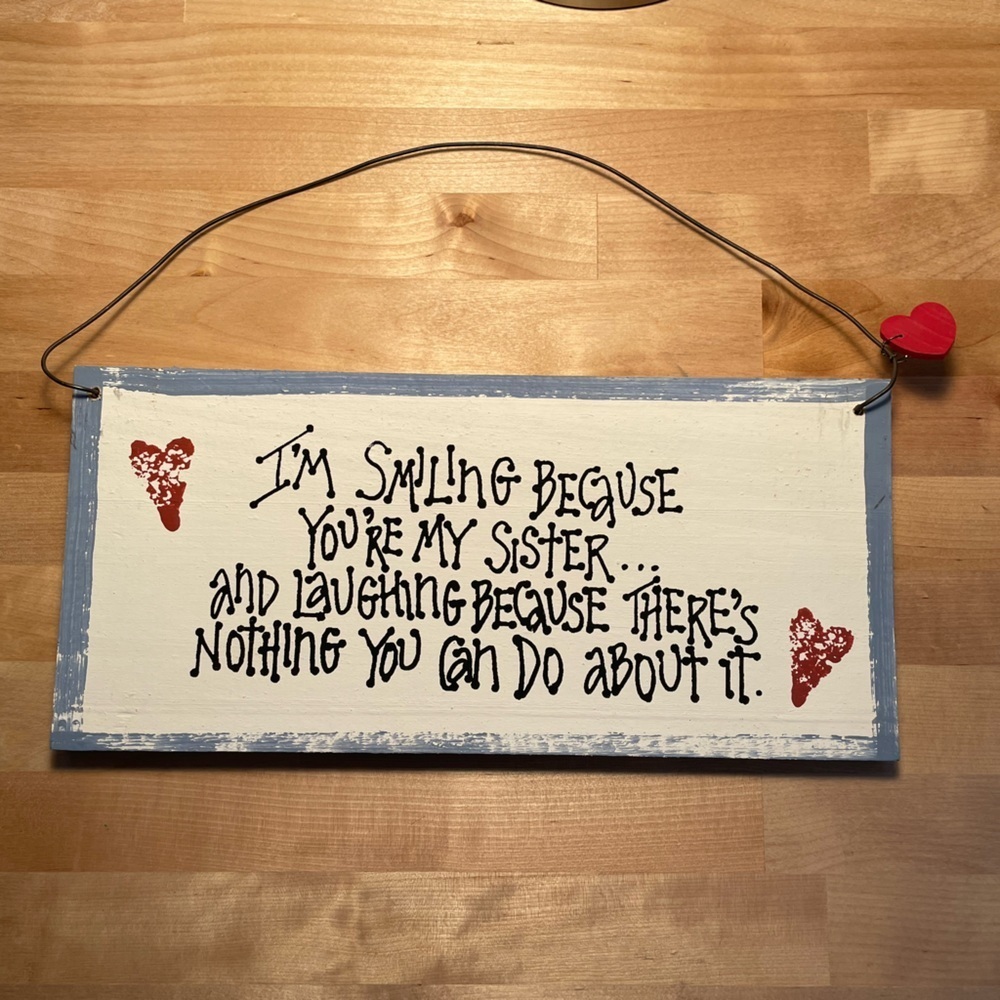 Wooden distressed painted sign
